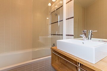 A bathroom with a sink and a bathtub