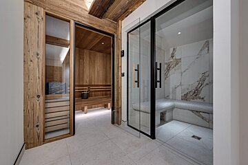 A walkway leading to a sauna and a steam room