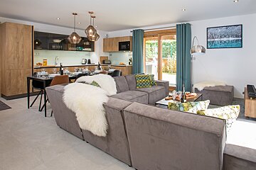 A living room with a couch and a table