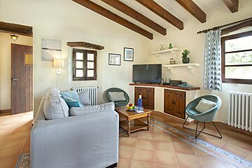 A living room with a couch and a television