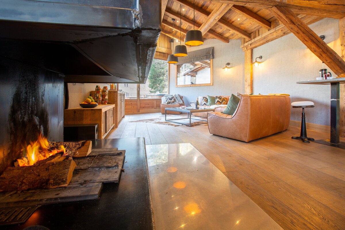 A living room with a fireplace and a couch