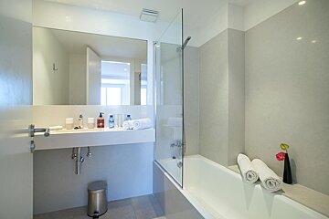 A bathroom with a sink and a bathtub