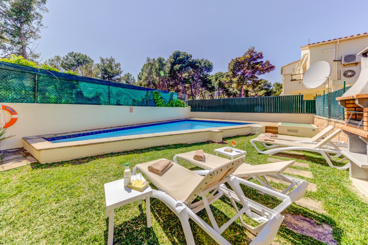 A swimming pool with a life preserver on the side of it