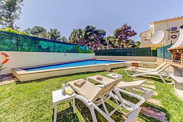 A swimming pool with a life preserver on the side of it