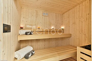A wooden sauna with the word ten80 on the bottom