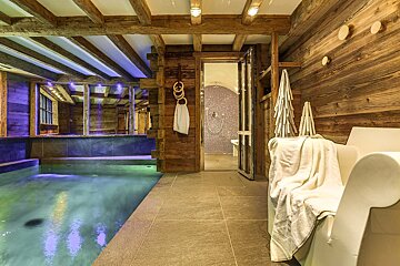 A bathroom with a bathtub and a swimming pool