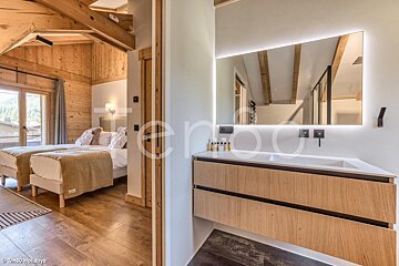 A bathroom with a sink and a mirror with the word holidays on it