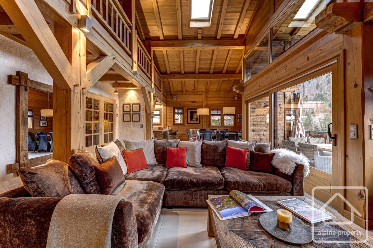 A living room with a couch that says alpine property on it