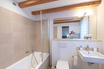 A bathroom with a bathtub a toilet and a sink