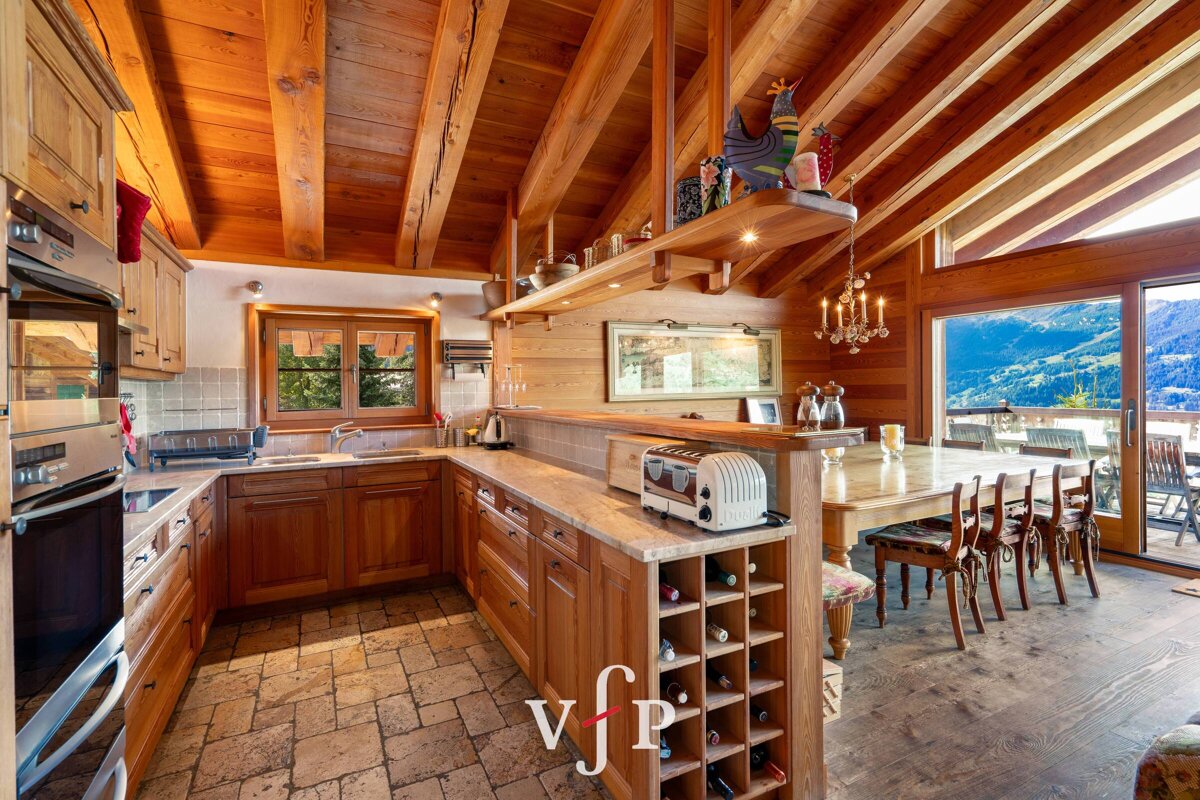A kitchen with a toaster and a wine rack with the letter v on it