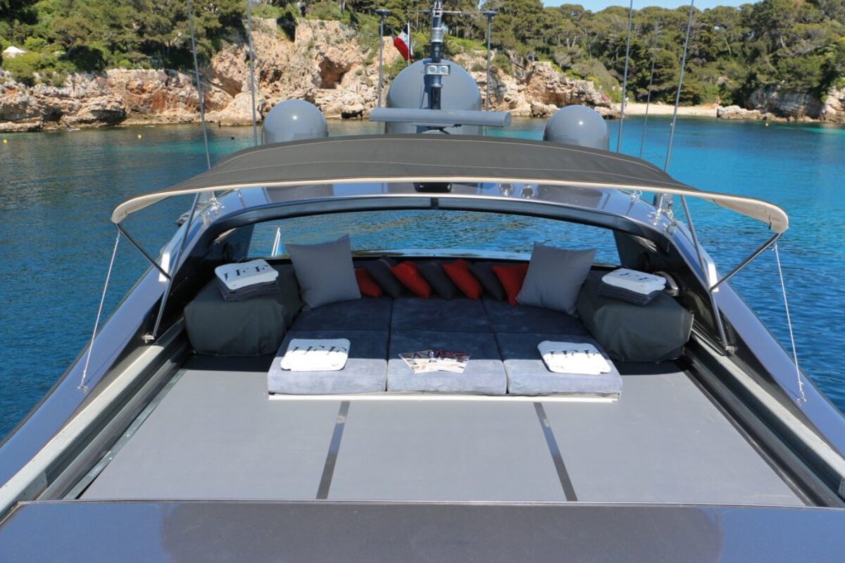 The front of a boat with a few towels on it that say t.p.i