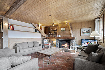 A living room with a fireplace and a couch