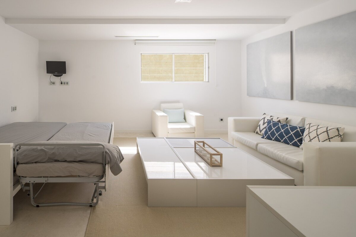 A living room with a couch and a chair