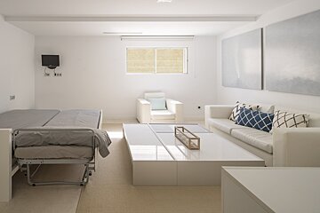 A living room with a couch and a chair