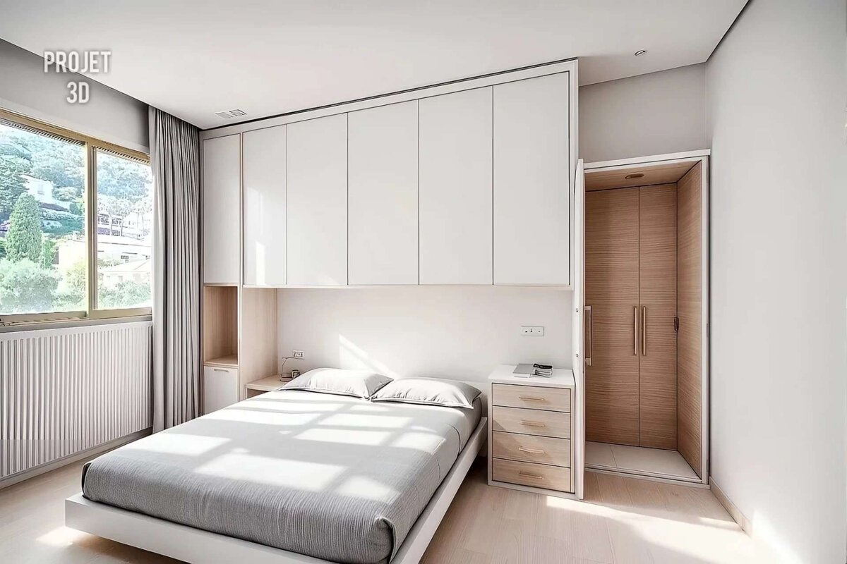 A minimalist bedroom with a white bed, integrated overhead cabinets, large window, and a light wood closet, bathed in natural light.