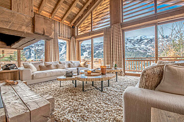 A living room with a couch and two coffee tables