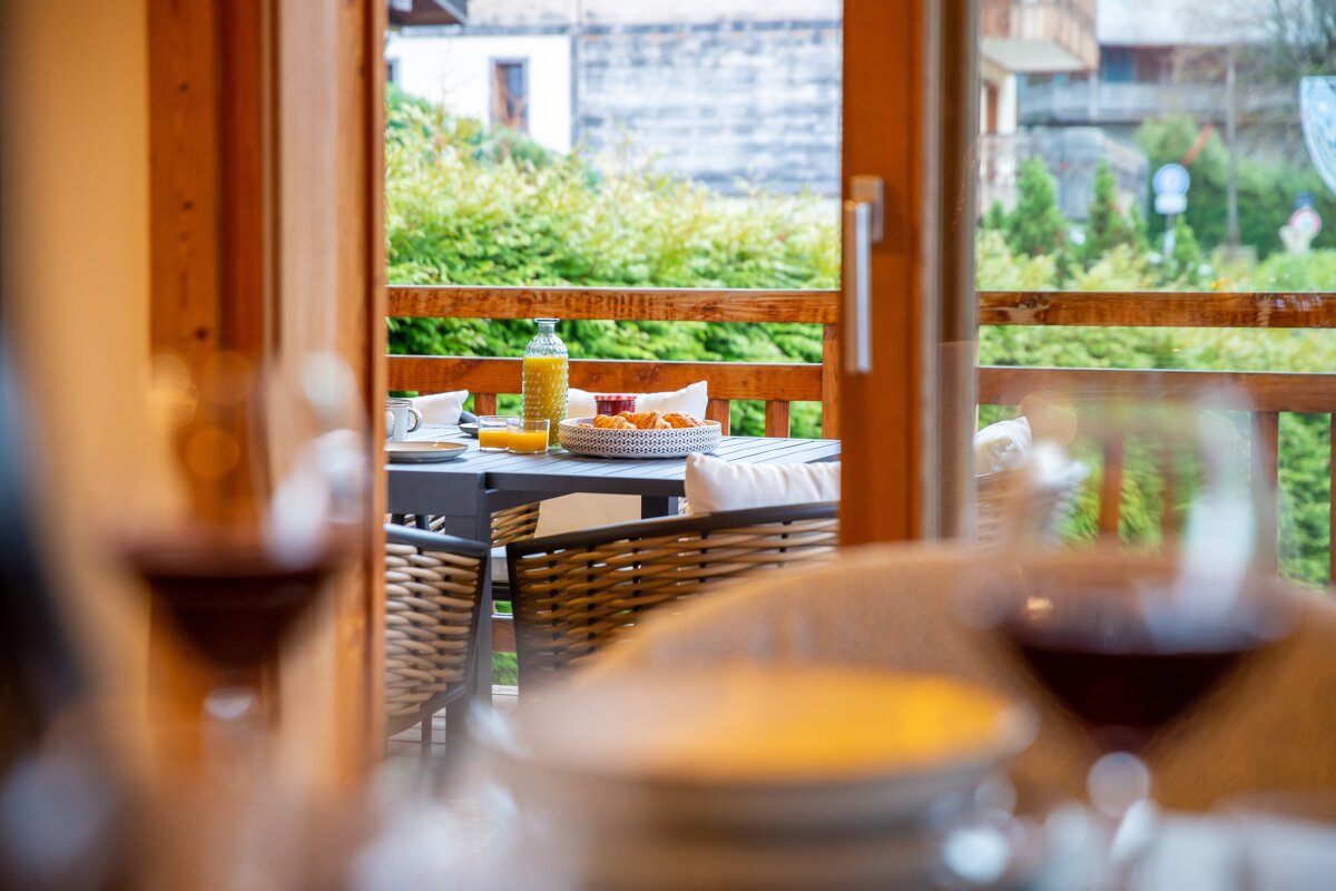 A table with a bottle of olive oil on it