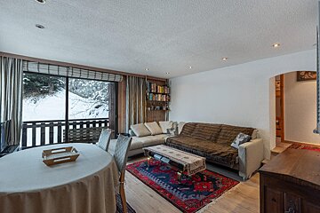 A living room with a couch and a table
