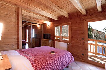 A bedroom with a bed and a book on it