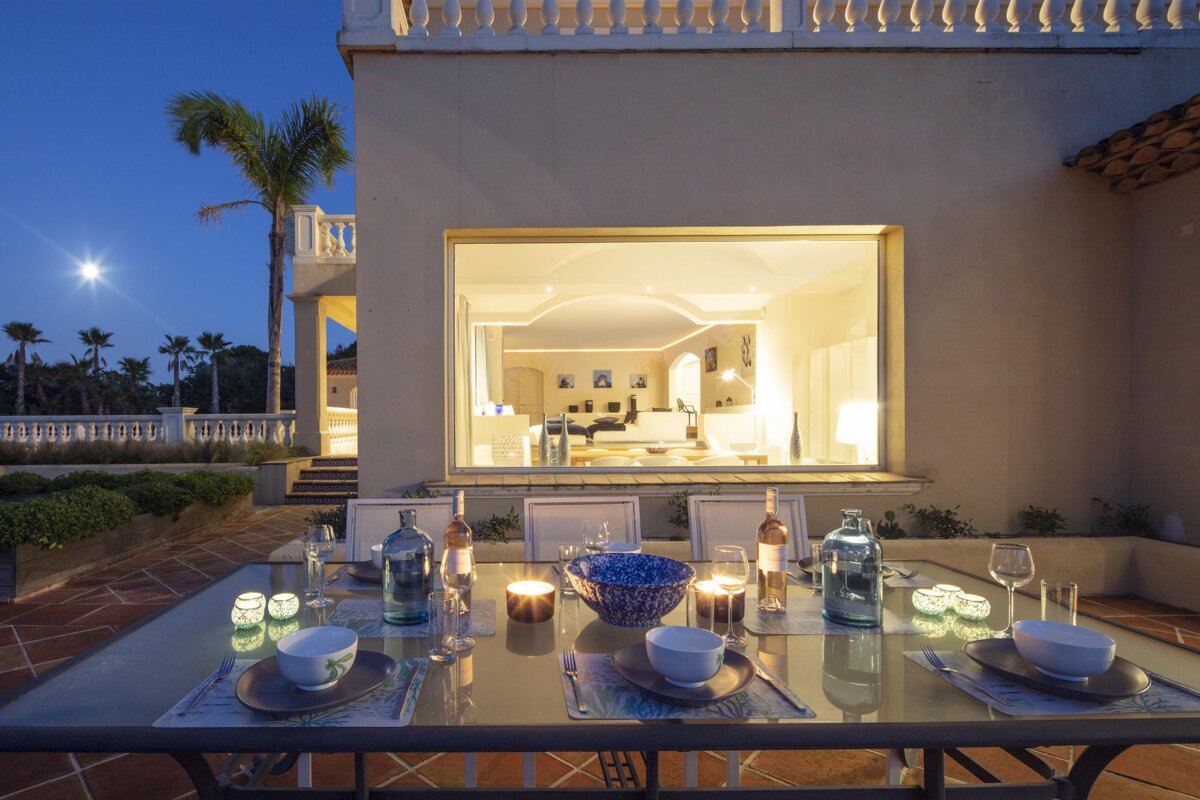 A table set for a dinner with candles on it
