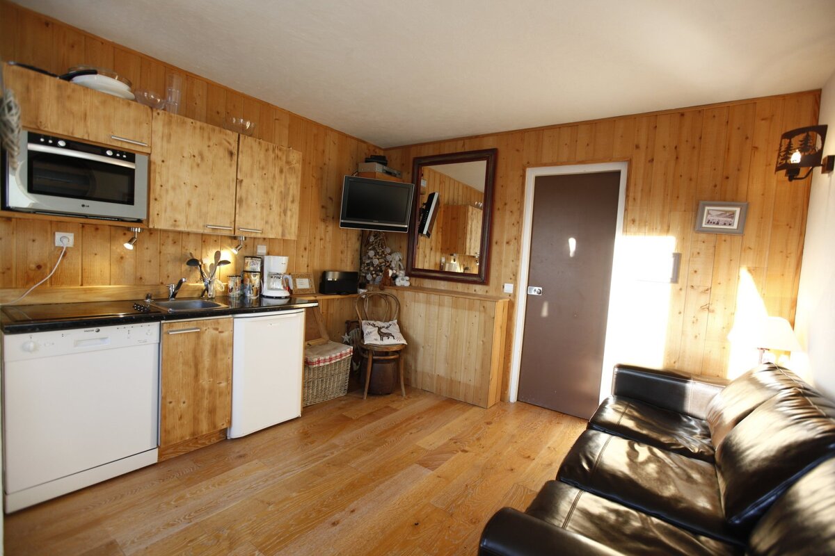 A kitchen with a lg dishwasher and a microwave