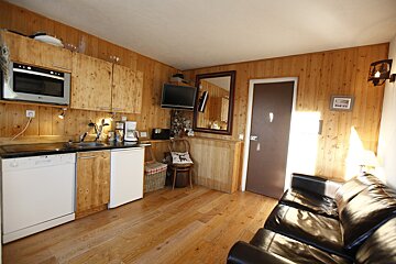 A kitchen with a lg dishwasher and a microwave