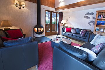 A living room filled with furniture and a fireplace