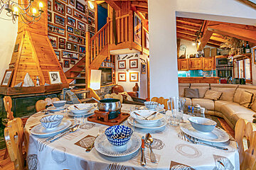 A table with plates and bowls on it in a living room