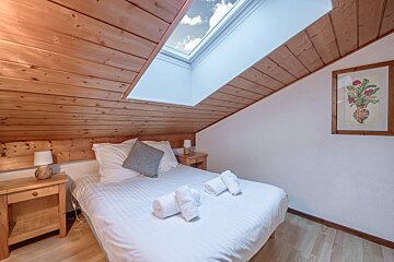 A room with a couch and a chair in it