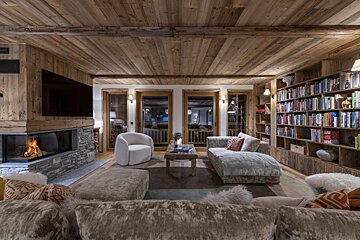 A living room with a fireplace and a couch