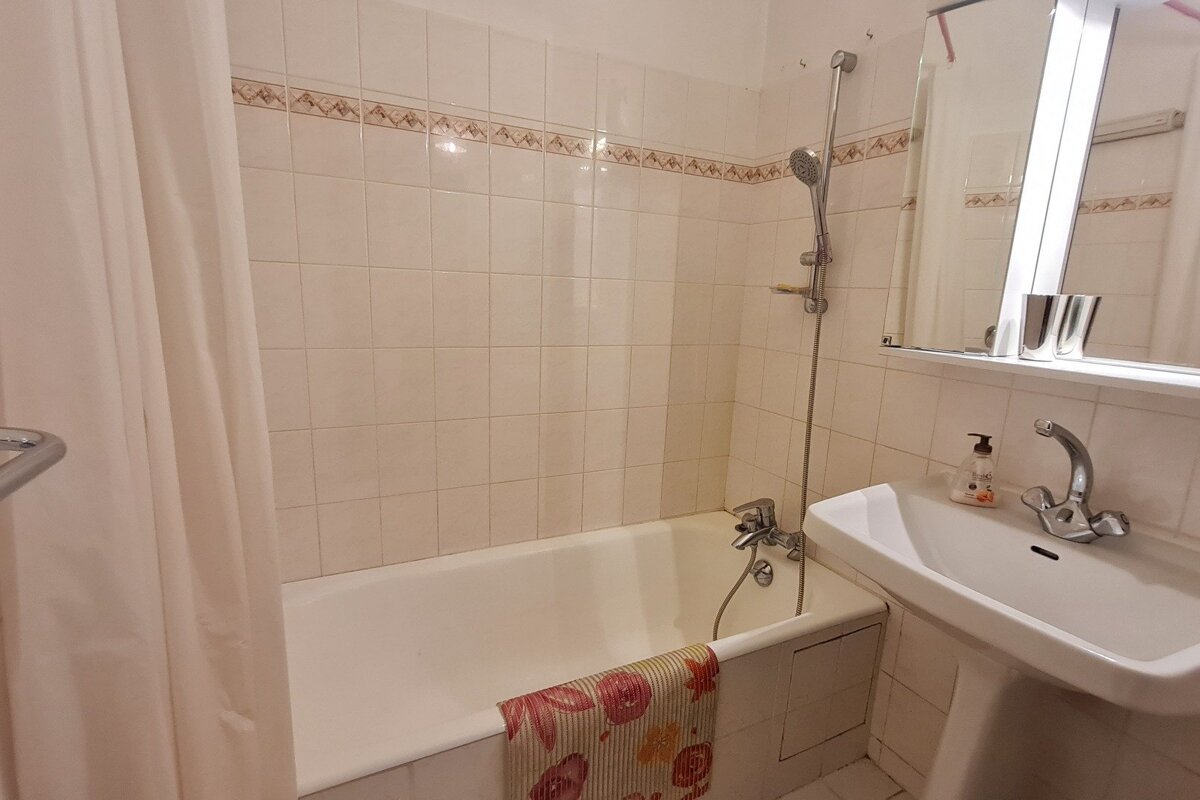 A bathroom with a sink and a bathtub