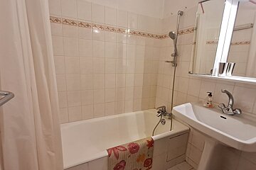 A bathroom with a sink and a bathtub