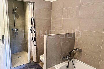 A bathroom with the word home on the wall