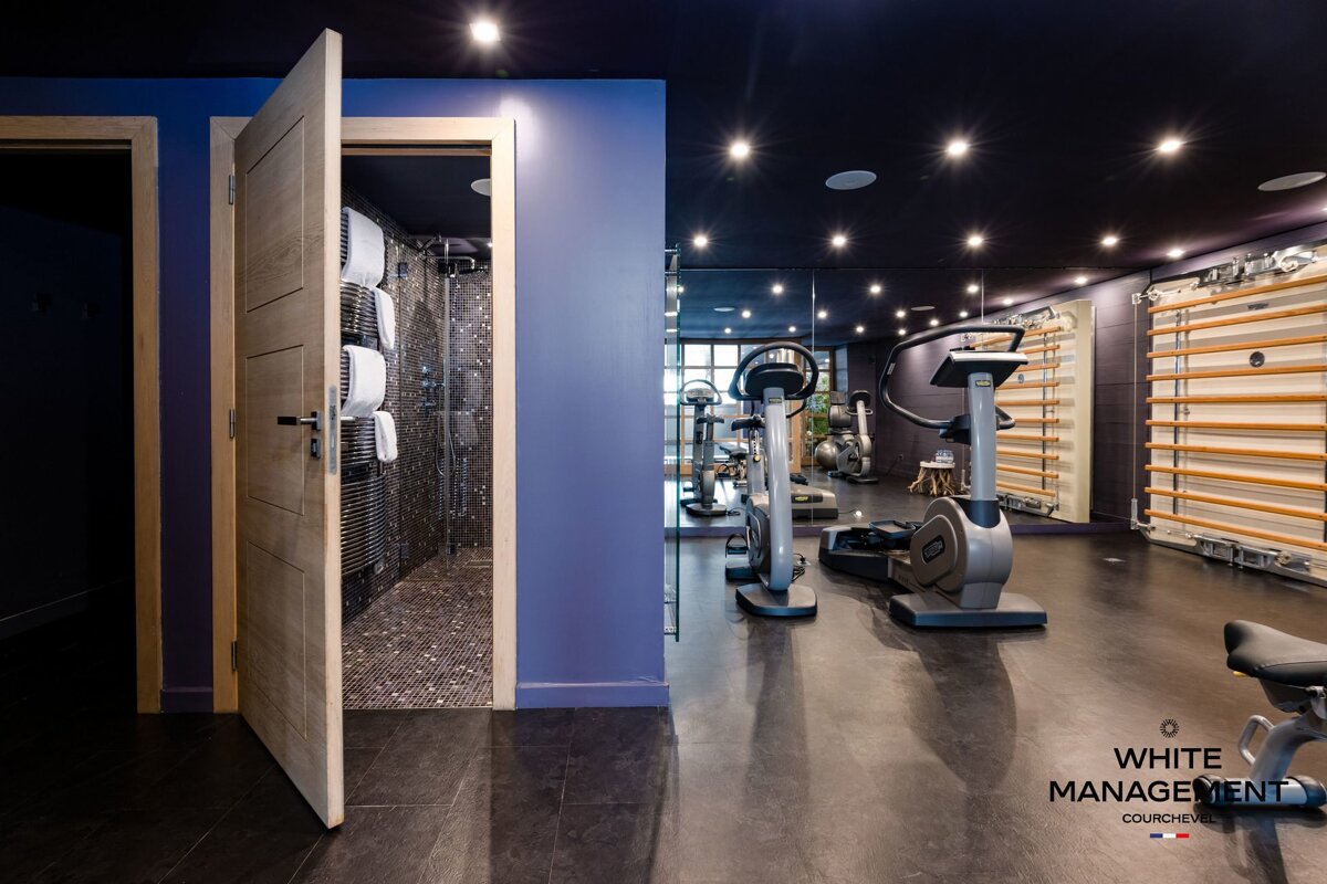 A gym with a rental designer logo in the corner