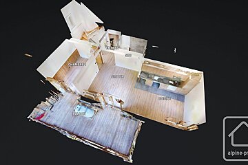 A 3D floor plan model of a home, showing rooms like a bedroom, living room, kitchen, bathroom, entrance, and balcony, with French labels.