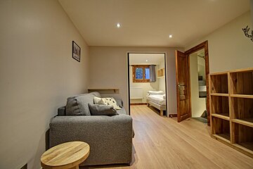 A bedroom with two beds and a radiator