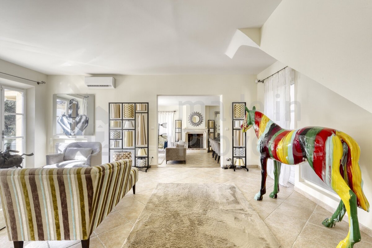 A colorful statue of a horse in a living room