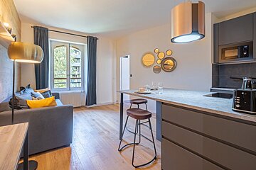 A kitchen with a toaster oven and a microwave