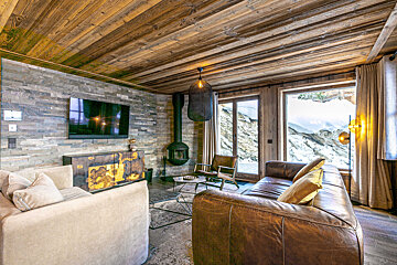 A living room with a couch and a television