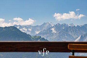 A view of a mountain range with the letters vjp on the bottom