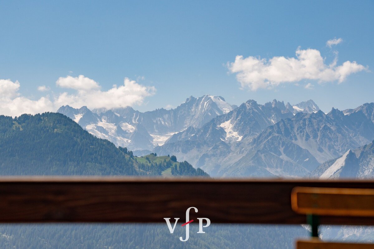 A view of a mountain range with the letters vjp on the bottom