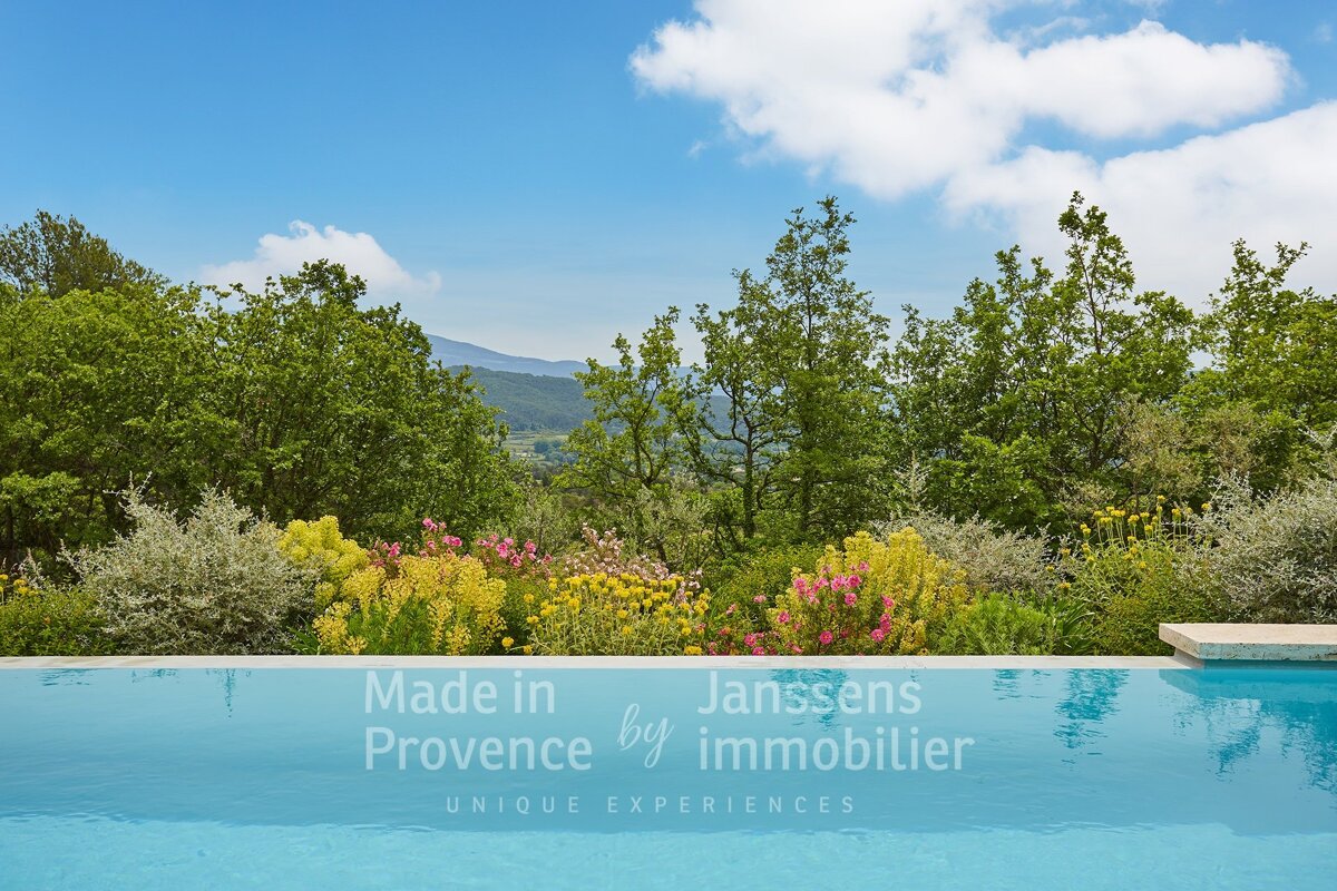 A swimming pool with the words made in provence by immobilier on it