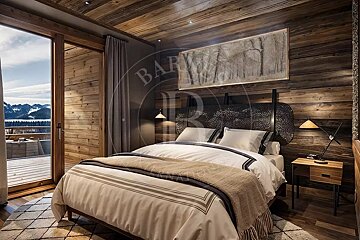 A cozy, rustic bedroom with wooden walls/ceiling, large bed, and a beautiful mountain view from the sliding glass doors and balcony.