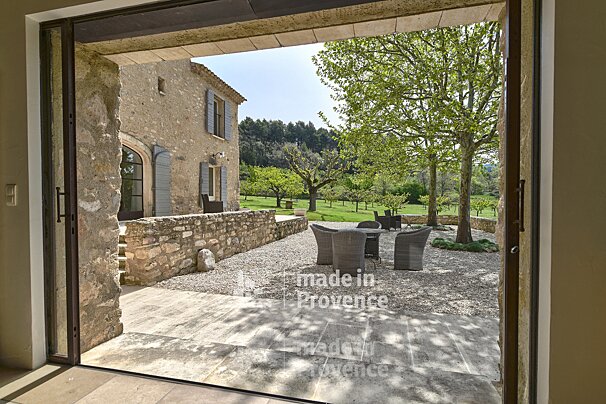 A patio with a table and chairs made in provence