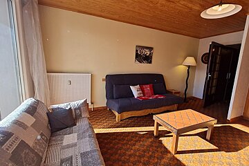A living room with a couch and a coffee table
