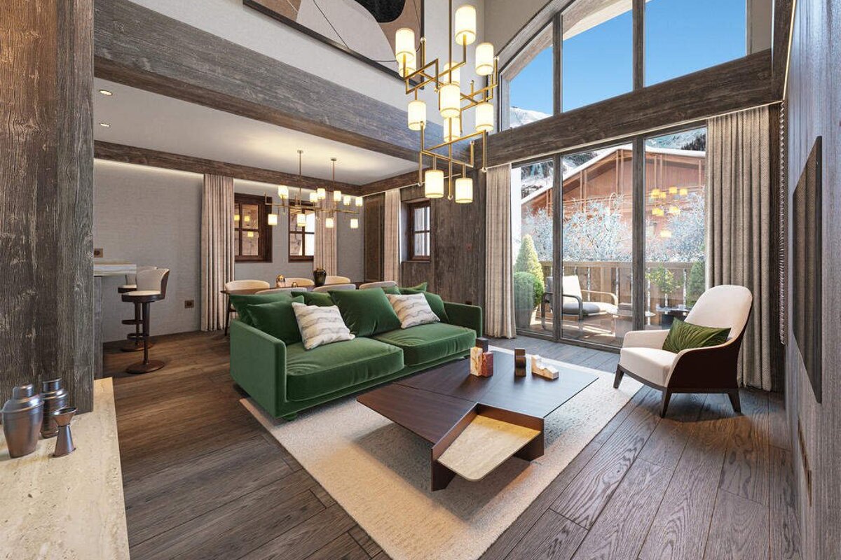A chic chalet living room with a green sofa, warm wood interior, and massive windows offering a serene view of snowy mountains.