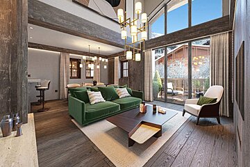 Modern rustic living room featuring a green velvet sofa, stylish coffee table, gold chandelier, and large windows with a chalet view.