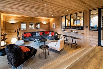 A living room with a couch and chairs in it