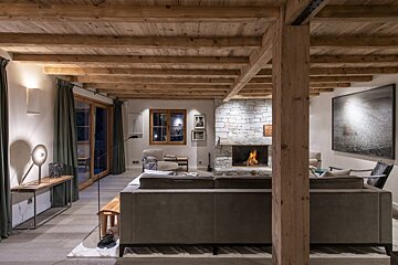 A living room with a fireplace and a couch