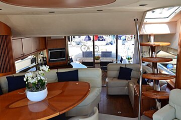 A living room with a couch a table and a television